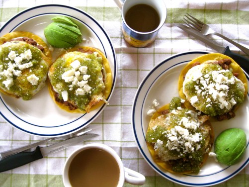 Huevos Rancheros with beans, tomatillo salsa, avocado, and queso fresco