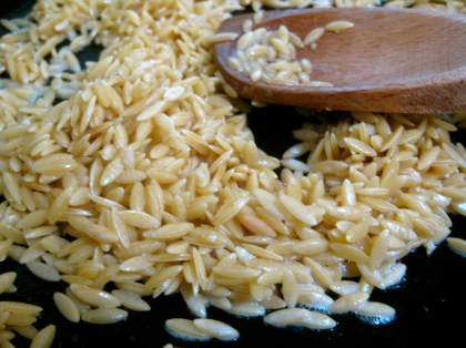 Toasting the orzo for Toasted Orzo with Kale, Feta, and Radishes