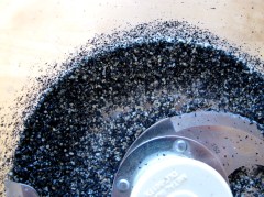 Grinding black sesame seeds into a paste