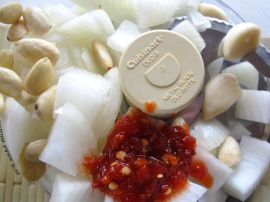 Blanched almonds, onion, and sambal oelek for Sambal Goreng Telur (Indonesian Egg Curry)