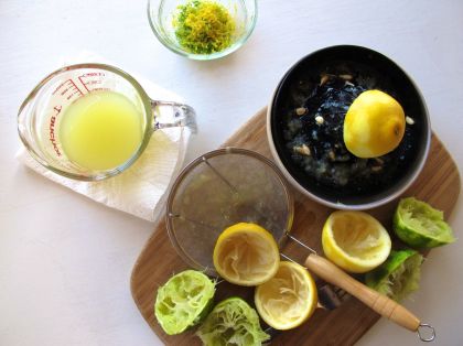 Zesting and juicing lemons and limes for Zesty Lemon Lime Bars