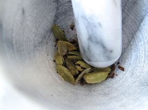 Green cardamom pods for grinding