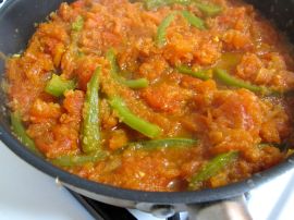 Onions, green bell peppers, and tomatoes for Parsi Tomato-Poached Eggs