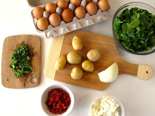 Frittata ingredients: Eggs, potatoes, spinach, sundried tomatoes, basil, and feta Frittata ingredients: Eggs, potatoes, spinach, sundried tomatoes, basil, and feta