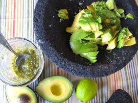 Making Roasted Tomatillo Guacamole with a molcajete Making Roasted Tomatillo Guacamole with a molcajete
