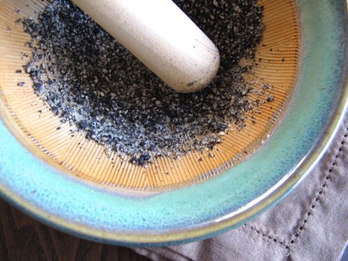 Grinding black sesame seeds with a suribachi for Kurogoma Dressing