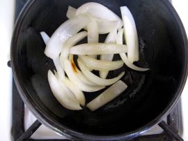 Cooking onions in a ttukbaegi for Doenjang Jjigae Cooking onions in a ttukbaegi for Doenjang Jjigae