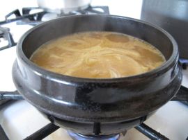 Making Doenjang Jjigae (Savory Korean stew with zucchini, tofu, and shrimp) Making Doenjang Jjigae (Savory Korean stew with zucchini, tofu, and shrimp)