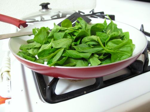 Making Skillet-Baked Eggs with Garlicky Yogurt, Spinach, and Cherry Tomatoes Making Skillet-Baked Eggs with Garlicky Yogurt, Spinach, and Cherry Tomatoes