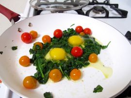 Spinach Nests for Skillet-Baked Eggs with Garlicky Yogurt and Cherry Tomatoes Spinach Nests for Skillet-Baked Eggs with Garlicky Yogurt and Cherry Tomatoes