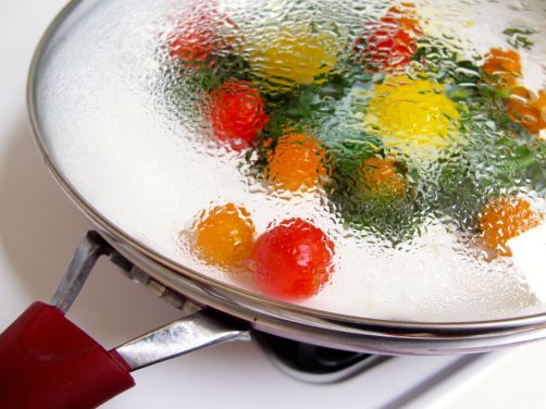 Making Skillet-Baked Eggs with Garlicky Yogurt, Spinach, and Cherry Tomatoes Making Skillet-Baked Eggs with Garlicky Yogurt, Spinach, and Cherry Tomatoes