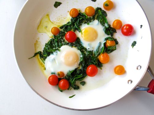 Making Skillet-Baked Eggs with Garlicky Yogurt, Spinach, and Cherry Tomatoes Making Skillet-Baked Eggs with Garlicky Yogurt, Spinach, and Cherry Tomatoes