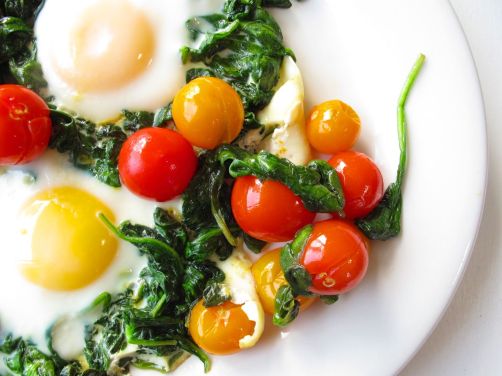 Skillet-Baked Eggs with Garlicky Yogurt, Spinach, and Cherry Tomatoes Skillet-Baked Eggs with Garlicky Yogurt, Spinach, and Cherry Tomatoes