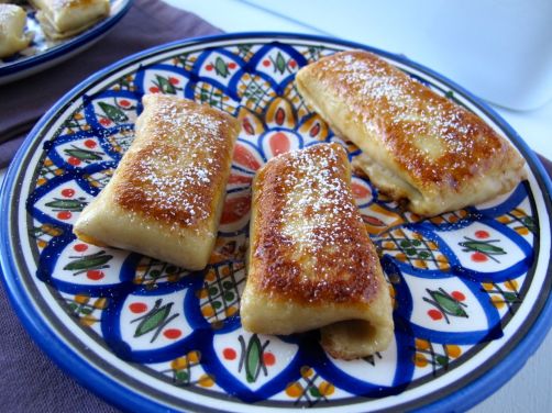 Pumpkin Cheese Blintzes caramelized in butter and sugar