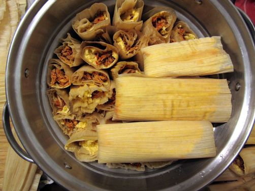 Packing the tamales into the steamer basket