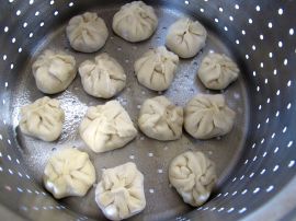 Nepali Momos (Steamed Dumplings) in a steamer basket