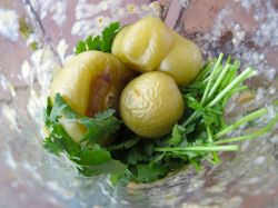 Blending in cilantro and roasted tomatillos